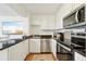 Modern kitchen with stainless steel appliances and granite countertops at 210 5Th S Ave # 307, St Petersburg, FL 33701