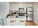 Updated kitchen featuring stainless steel appliances and granite counters at 210 5Th S Ave # 307, St Petersburg, FL 33701