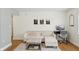 Living room with sectional sofa, ottoman, and dining nook at 210 5Th S Ave # 307, St Petersburg, FL 33701