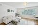 Living room with sectional sofa, ottoman, and built-in seating at 210 5Th S Ave # 307, St Petersburg, FL 33701