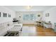 Living area features a sectional sofa, ottoman, and workspace at 210 5Th S Ave # 307, St Petersburg, FL 33701