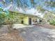 Light green Ranch home with carport and a spacious driveway at 2148 Cunningham Dr, Clearwater, FL 33763