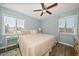 King-size bed in a spacious bedroom with light blue walls at 2215 1St St # A & B, Indian Rocks Beach, FL 33785