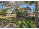 Charming beach cottage exterior with lush landscaping at 2215 1St St # A & B, Indian Rocks Beach, FL 33785