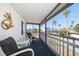 Relaxing screened porch with outdoor seating and water view at 2215 1St St # A & B, Indian Rocks Beach, FL 33785