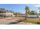 Vacant lot next to a beach home with a white fence at 2215 1St St # A & B, Indian Rocks Beach, FL 33785