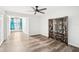 Well-lit bedroom with wood-look floors and an oriental screen at 2794 Countryside Blvd # 1, Clearwater, FL 33761