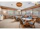Community room with tables, chairs, and large windows at 3062 Eastland Blvd # 405, Clearwater, FL 33761