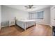Main bedroom with ceiling fan and hardwood floors at 3062 Eastland Blvd # 405, Clearwater, FL 33761
