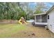 Backyard with playset and screened porch at 33933 Terrace Blvd, Wesley Chapel, FL 33543