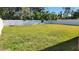 Large fenced backyard with grassy lawn at 4119 Harrisburg Ne St, St Petersburg, FL 33703