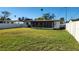View of house and large backyard from the back at 4119 Harrisburg Ne St, St Petersburg, FL 33703