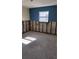Unfinished basement room with painted walls and concrete floor at 4119 Harrisburg Ne St, St Petersburg, FL 33703