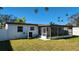 Rear view of house, showcasing screened patio at 4119 Harrisburg Ne St, St Petersburg, FL 33703