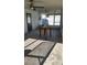 Screened patio with concrete floor and table at 4119 Harrisburg Ne St, St Petersburg, FL 33703