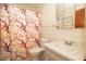 Bathroom with a floral shower curtain and a vanity with a single sink at 4427 Gandy Cir, Tampa, FL 33616