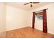 Simple bedroom with hardwood floors and red curtains at 4427 Gandy Cir, Tampa, FL 33616