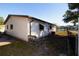 Side view of a house with light-colored siding at 4427 Gandy Cir, Tampa, FL 33616