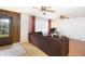Living room with brown sectional sofa and hardwood floors at 4427 Gandy Cir, Tampa, FL 33616