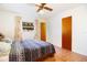 Bedroom with double bed, window and hardwood floors at 4427 Gandy Cir, Tampa, FL 33616