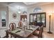 Spacious dining room with large windows and a decorative chandelier at 512 Creekside Ct, Safety Harbor, FL 34695