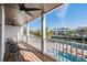 Relaxing balcony overlooking the water with amazing views and ceiling fans at 519 Loquat Dr, Anna Maria, FL 34216