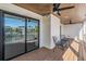 Covered balcony with canal views and sliding glass doors at 519 Loquat Dr, Anna Maria, FL 34216