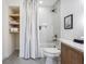 Modern bathroom with a bathtub, shower, and wooden vanity at 519 Loquat Dr, Anna Maria, FL 34216