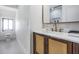 Modern bathroom with updated vanity, quartz countertop and stylish fixtures at 519 Loquat Dr, Anna Maria, FL 34216