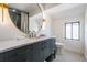 Spa-like bathroom with large mirror, walk-in shower, and modern vanity at 519 Loquat Dr, Anna Maria, FL 34216