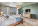 Main bedroom with king-size bed, water view, and modern decor at 519 Loquat Dr, Anna Maria, FL 34216