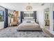 Bright bedroom with king bed and ensuite bathroom at 519 Loquat Dr, Anna Maria, FL 34216