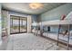 Bedroom with bunk beds and balcony access at 519 Loquat Dr, Anna Maria, FL 34216