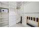 Large walk-in closet with shelving and hanging rods at 519 Loquat Dr, Anna Maria, FL 34216