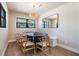 Charming dining room with built-in bench seating and a statement chandelier at 519 Loquat Dr, Anna Maria, FL 34216