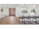 Spacious entryway with wood door and built-in storage at 519 Loquat Dr, Anna Maria, FL 34216