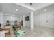 Spacious game room with comfortable seating, a large TV, and marble floors at 519 Loquat Dr, Anna Maria, FL 34216