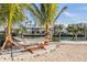 Relaxing hammock area on a sandy beach with water views at 519 Loquat Dr, Anna Maria, FL 34216