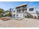 Two-story home with a pool, deck, and waterfront view at 519 Loquat Dr, Anna Maria, FL 34216