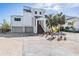 Modern two-story home with stylish exterior at 519 Loquat Dr, Anna Maria, FL 34216