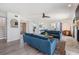 Bright and airy living room with fireplace and two blue sofas at 519 Loquat Dr, Anna Maria, FL 34216