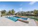 Resort-style pool and spa with lounge chairs, offering waterfront views at 519 Loquat Dr, Anna Maria, FL 34216