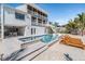 Stunning pool and spa area with lounge chairs at 519 Loquat Dr, Anna Maria, FL 34216