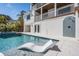 Stunning pool with a built-in lounge chair and view of the home at 519 Loquat Dr, Anna Maria, FL 34216