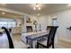 Light-filled dining area with stylish wood chairs and a decorative table centerpiece at 5201 Cicero Dr, New Port Richey, FL 34652