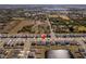 Aerial view of a house in a quiet residential neighborhood at 5462 Logan Cave Ave, Wimauma, FL 33598
