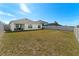 Large backyard with fenced perimeter at 5462 Logan Cave Ave, Wimauma, FL 33598