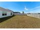 Spacious backyard with fenced perimeter at 5462 Logan Cave Ave, Wimauma, FL 33598