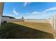Large backyard with fenced perimeter at 5462 Logan Cave Ave, Wimauma, FL 33598