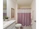 Clean bathroom with shower/tub combo and modern vanity at 5462 Logan Cave Ave, Wimauma, FL 33598